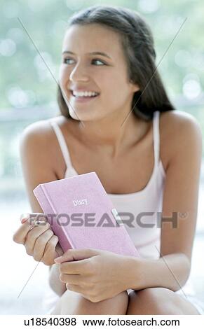 Teenage girl and her diary View Large Photo Image Stock Photo - Teenage girl and her diary. Fotosearch
