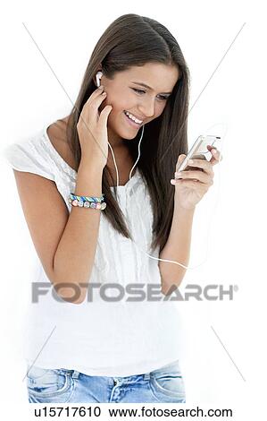 Teenage girl listening to music View Large Photo Image Stock Image - Teenage girl listening to music. Fotosearch