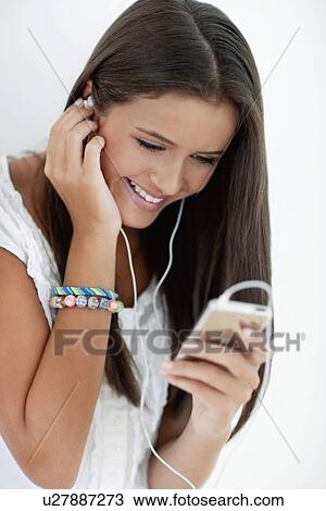 Teenage girl listening to music View Large Photo Image Stock Image - Teenage girl listening to music. Fotosearch