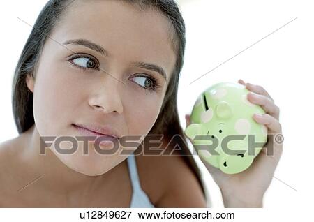 Teenage girl saving money View Large Photo Image Stock Photo - Teenage girl saving money. Fotosearch