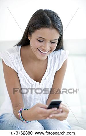 Teenage girl texting View Large Photo Image Stock Image - Teenage girl texting. Fotosearch
