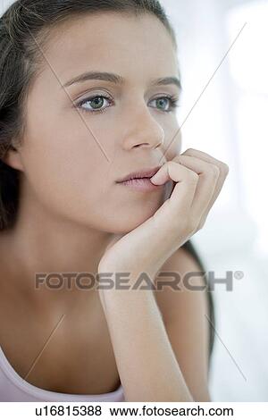 Thoughtful teenage girl View Large Photo Image Stock Photo - Thoughtful teenage girl. Fotosearch