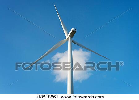 Stock Image - Wind turbine against cloud in blue sky, Zeewolde, Flevoland, Netherlands. Fotosearch