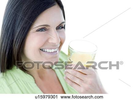 Woman drinking fruit juice View Large Photo Image Stock Image - Woman drinking fruit juice. Fotosearch
