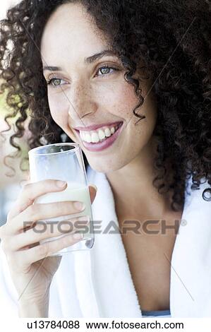 Woman drinking milk View Large Photo Image Stock Photo - Woman drinking milk. Fotosearch