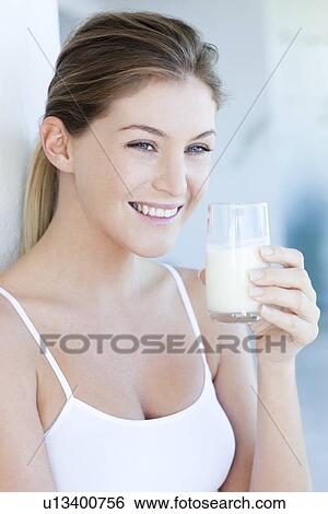 Woman drinking milk View Large Photo Image Stock Photograph - Woman drinking milk. Fotosearch