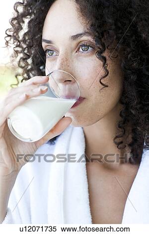 Stock Photography - Woman drinking milk. Fotosearch