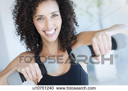 Woman exercising View Large Photo Image Stock Image - Woman exercising. Fotosearch