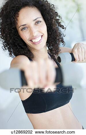 Stock Image - Woman exercising. Fotosearch
