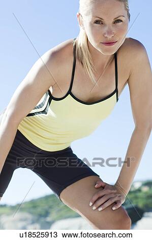 Stock Image - Woman exercising. Fotosearch
