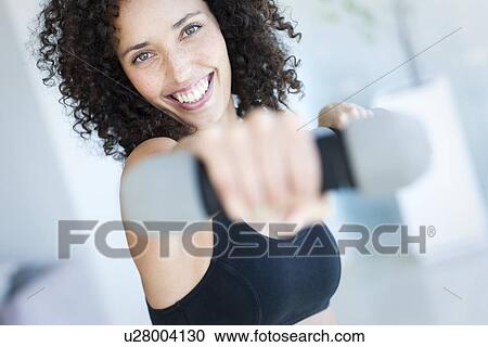 Woman exercising View Large Photo Image Stock Image - Woman exercising. Fotosearch