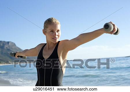 Stock Image - Woman exercising. Fotosearch