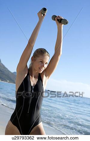 Stock Image - Woman exercising. Fotosearch