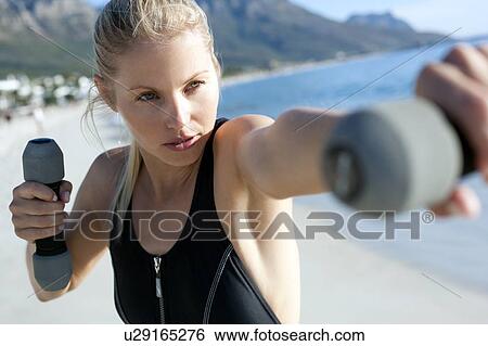 Stock Photograph - Woman exercising. Fotosearch