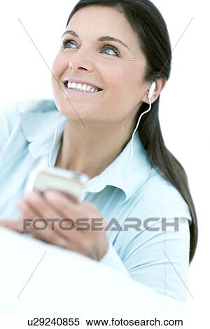 Stock Photography - Woman listening to music. Fotosearch