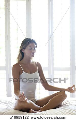 Stock Image - Woman meditating. Fotosearch