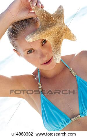 Stock Image - Woman on a beach. Fotosearch