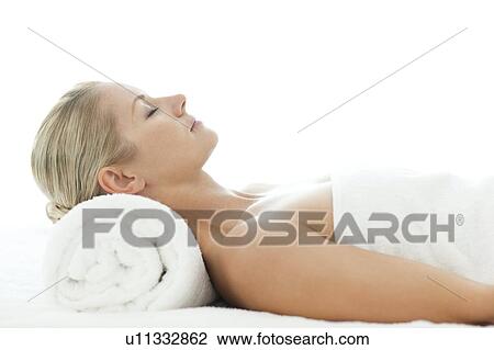 Woman relaxing at a spa View Large Photo Image Stock Image - Woman relaxing at a spa. Fotosearch