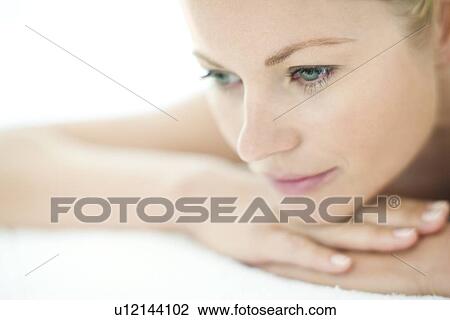 Stock Image - Woman relaxing at a spa. Fotosearch