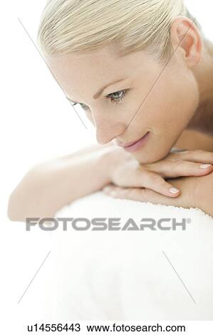 Stock Image - Woman relaxing at a spa. Fotosearch