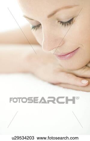 Stock Image - Woman relaxing at a spa. Fotosearch