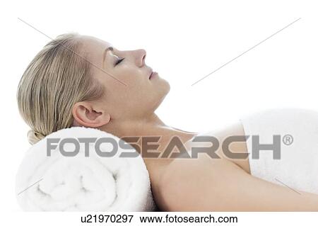 Stock Photo - Woman relaxing at a spa. Fotosearch