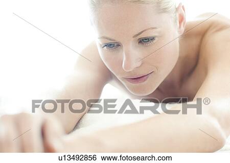 Woman relaxing at a spa View Large Photo Image Stock Photograph - Woman relaxing at a spa. Fotosearch