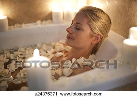 Woman relaxing in a bath View Large Photo Image Stock Image - Woman relaxing in a bath. Fotosearch