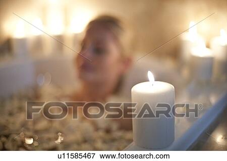 Woman relaxing in a bath View Large Photo Image Stock Photo - Woman relaxing in a bath. Fotosearch