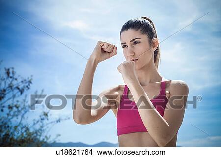 Picture - Woman shadowboxing. Fotosearch