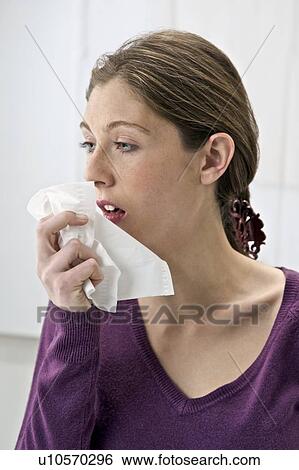 Stock Photograph - Woman sneezing. Fotosearch