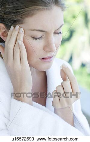 Woman taking painkillers View Large Photo Image Stock Image - Woman taking painkillers. Fotosearch
