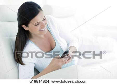 Picture - Woman texting. Fotosearch