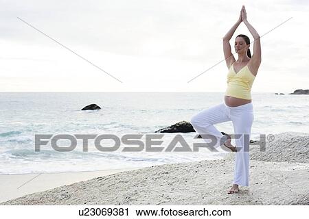 Stock Image - Yoga in pregnancy. Fotosearch