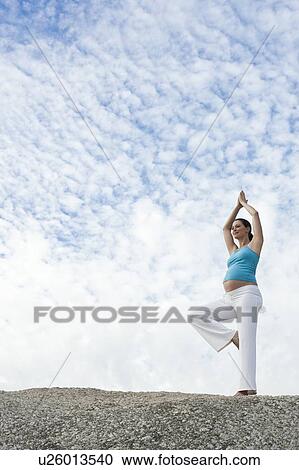 Stock Image - Yoga in pregnancy. Fotosearch