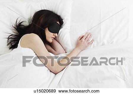 Young woman sleeping with sleep mask View Large Photo Image Stock Photo - Young woman sleeping with sleep mask. Fotosearch