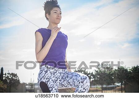 Young woman training at sport facility View Large Photo Image Stock Image - Young woman training at sport facility. Fotosearch
