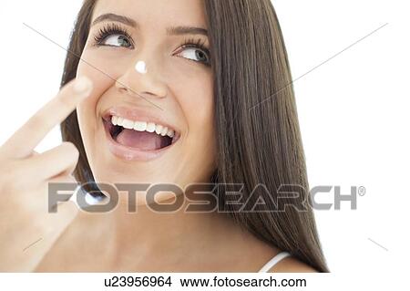 Applying face cream View Large Photo Image Picture - Applying face cream. Fotosearch