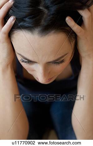 Stock Image - Depressed woman. Fotosearch