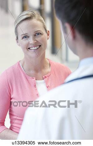 Stock Photography - Doctor and patient. Fotosearch