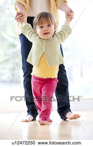 Stock Image - Learning to walk. Fotosearch