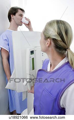 Man swallowing barium during an X-ray View Large Photo Image Stock Photograph - Man swallowing barium during an X-ray. Fotosearch