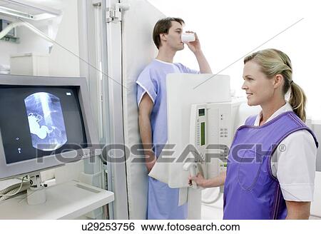 Man swallowing barium during an X-ray View Large Photo Image Stock Photograph - Man swallowing barium during an X-ray. Fotosearch