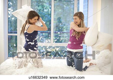 Pillow fight View Large Photo Image Stock Photo - Pillow fight. Fotosearch