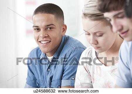 Stock Image - Pupils in a lesson. Fotosearch