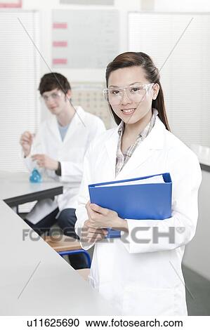 Stock Image - Pupils in a science lesson. Fotosearch
