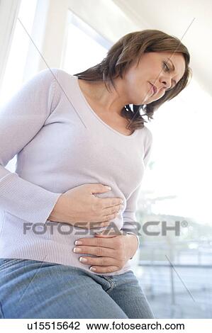 Stock Image - Stomach ache. Fotosearch