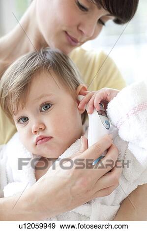 Taking a toddler's temperature View Large Photo Image Stock Photo - Taking a toddler's temperature. Fotosearch