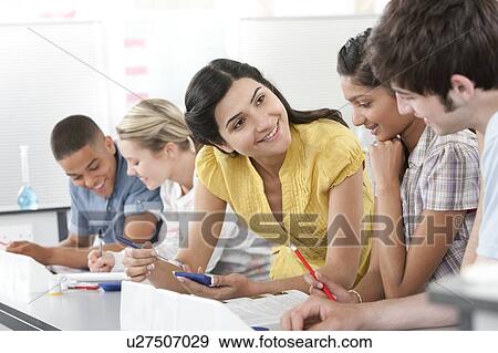 Teacher helping pupils View Large Photo Image Stock Photo - Teacher helping pupils. Fotosearch