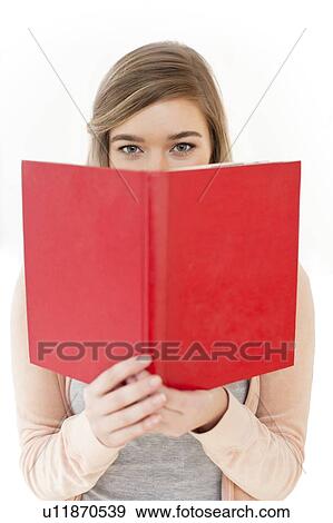 Stock Photo - Teenage girl reading. Fotosearch